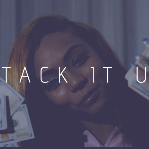 A person holding stacks of cash, partially obscured by the bold text "STACK IT UP" in large letters. The dimly lit background creates a dark and moody atmosphere that evokes the vibes of a Cuban Doll type beat.